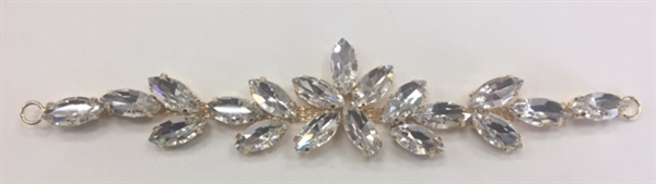 BKL-RHS-016-GOLD. Clear Crystals on Gold Metal Applique / Buckle - 6 X 1 Inches. Has hooks at booth ends. Very versatile accessory on garments and swim-suits.