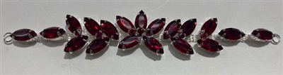BKL-RHS-016-RED. Red Crystals on Silver Applique / Buckle - 6 X 1 Inches. Has hooks at booth ends. Very versatile accessory on garments and swim-suits.