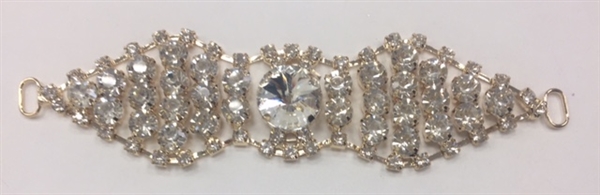 BKL-RHS-017-ROSEGOLD. Clear Crystals on Rose-Gold Metal Applique / Buckle - 5 X 1.2 Inches. Has hooks at booth ends. Very versatile accessory on garments and swim-suits.