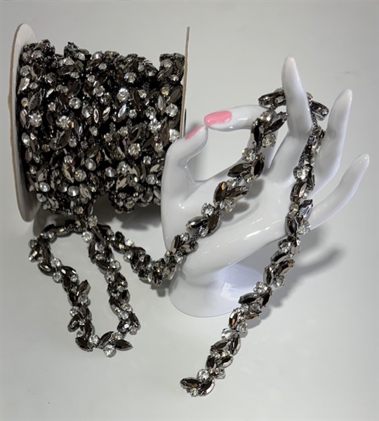 CHN-RHS-062-BLACK. Clear and Black Crystal Rhinestone Chain - Clear and Black Crystals Set in Black Claws on a Black Metal Backing - 5/8 Inch Wide